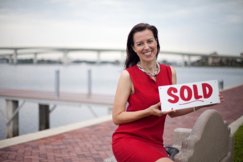 Karin Udolf with Sold sign
