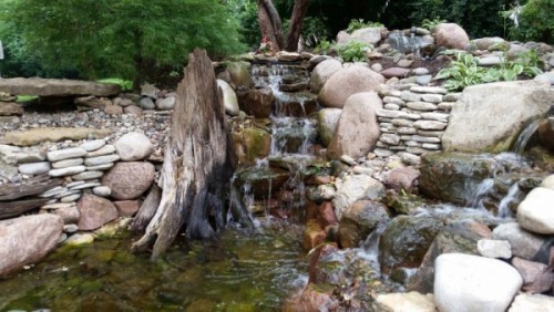 Kansas City Landscaping Firm Creates Water Feature with MO River Driftwood