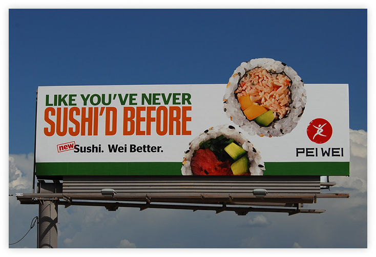 Billboard ad for Pei Wei featuring sushi rolls and the slogan 'LIKE YOU'VE NEVER SUSHI'D BEFORE.