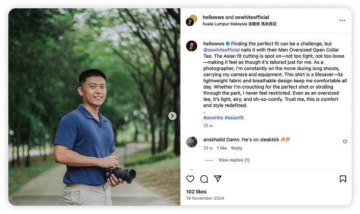 Landscape photographer Wil Son holding a camera and promoting Oxwhite clothing outdoors.