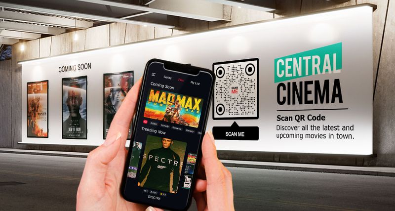 A movie billboard at Central Cinema with a QR code and posters for upcoming films; a person scans it using a smartphone.