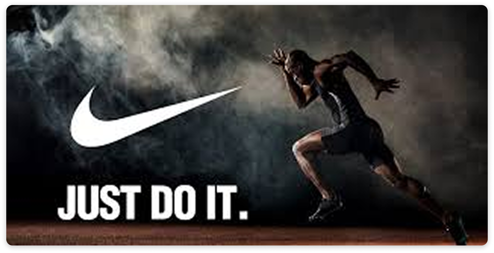 Nike ad showing a sprinter in motion with the swoosh logo and the words ‘Just Do It.’ on a dark, dramatic background.
